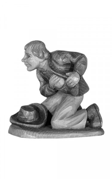 Shepherd kneeling with hat